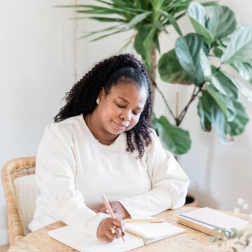 writing at desk reviewing living trust and items to avoid probate